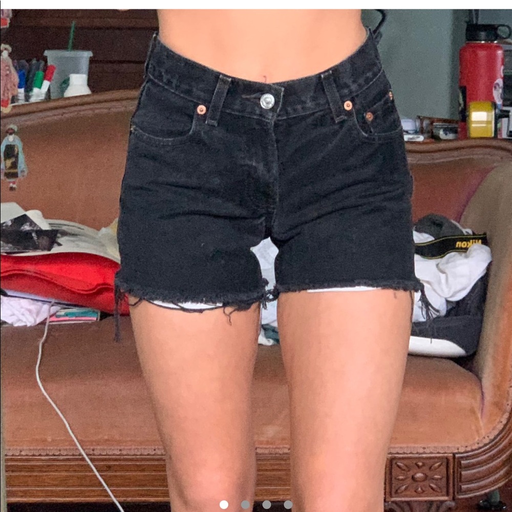 Black Levi’s denim shirt.